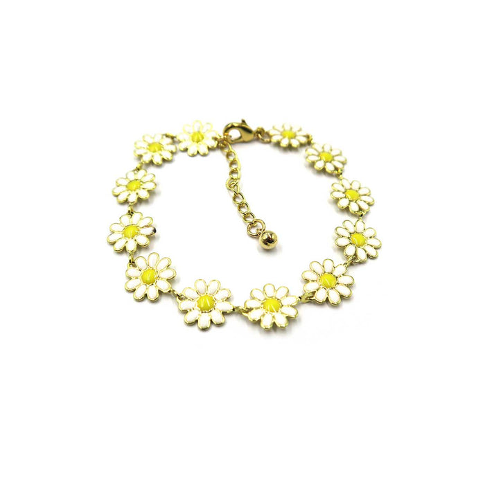 A gold-plated bracelet featuring a series of daisy flower charms with white enamel petals and yellow centers, arranged in a circle on a plain white background.
