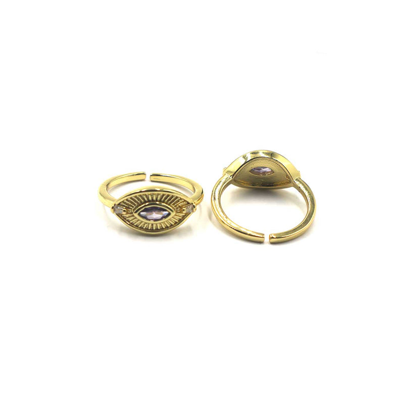 Two gold-toned split ring earrings with oval eye motifs and small purple stones, displayed on a clean white background.