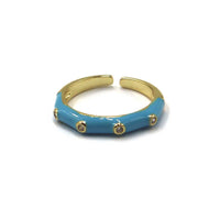 A gold-plated open cuff bracelet with a glossy turquoise blue enamel inlay and small gold bezel-set clear stones, shown on a white background with text overlays MER1246-02.